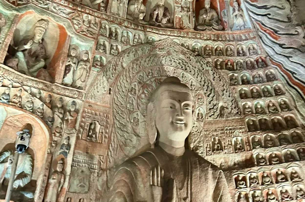 The Spiritual Significance of Yungang Grottoes Tryadhva-buddha Statue