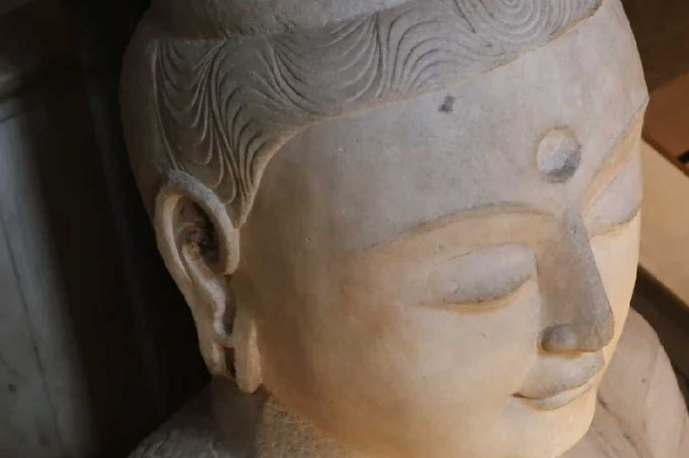 The Artistry of Serenity: Unraveling the Expression of Stone Buddha